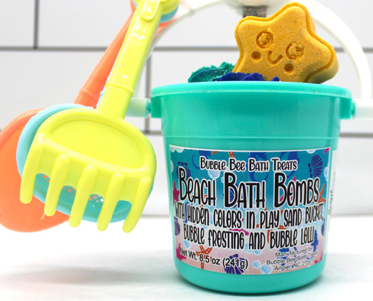 Summer beach bath bomb with bubble frosting and bubble lollipop in mini plastic bucket with sand toys